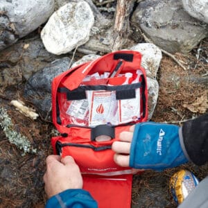 Emergency first aid kit for outdoor survival and camping preparedness.