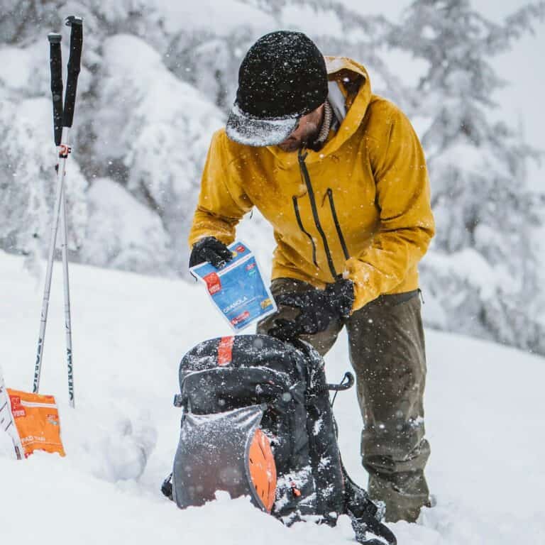 Warm winter hiking jacket with waterproof features for cold weather outdoor survival gear.