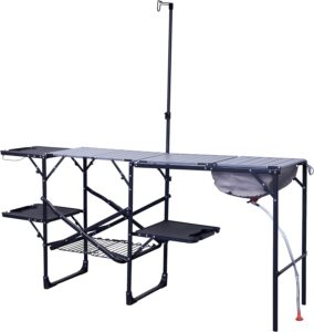 Foldable camping and outdoor cooking prep station with sink and storage shelves for survival camping gear.