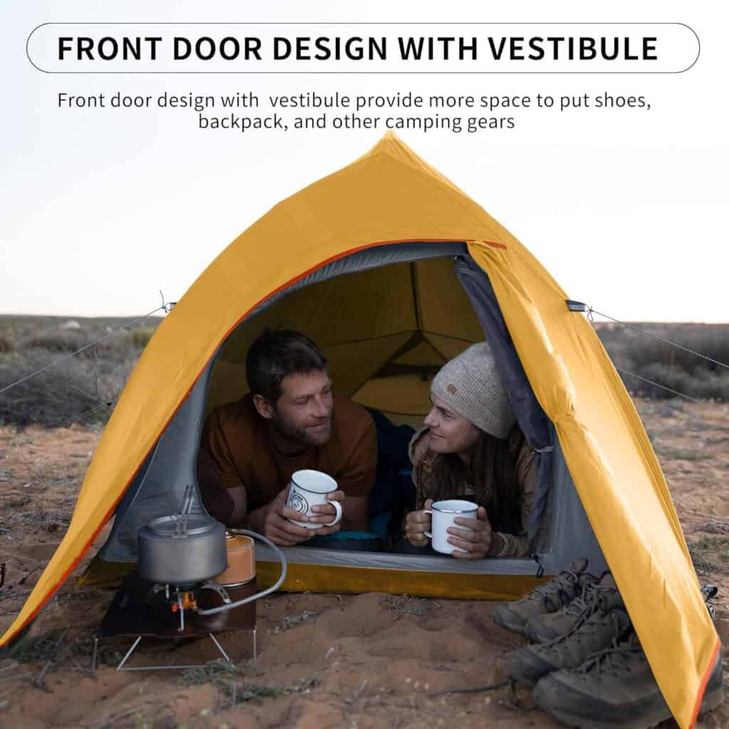 Portable camping tent with vestibule for outdoor survival and camping gear storage.
