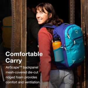 Backpacking woman with blue hiking backpack outdoors.