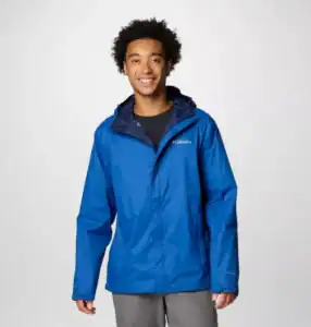Lightweight blue Columbia waterproof outdoor jacket for men, ideal for hiking and camping in all weather conditions.